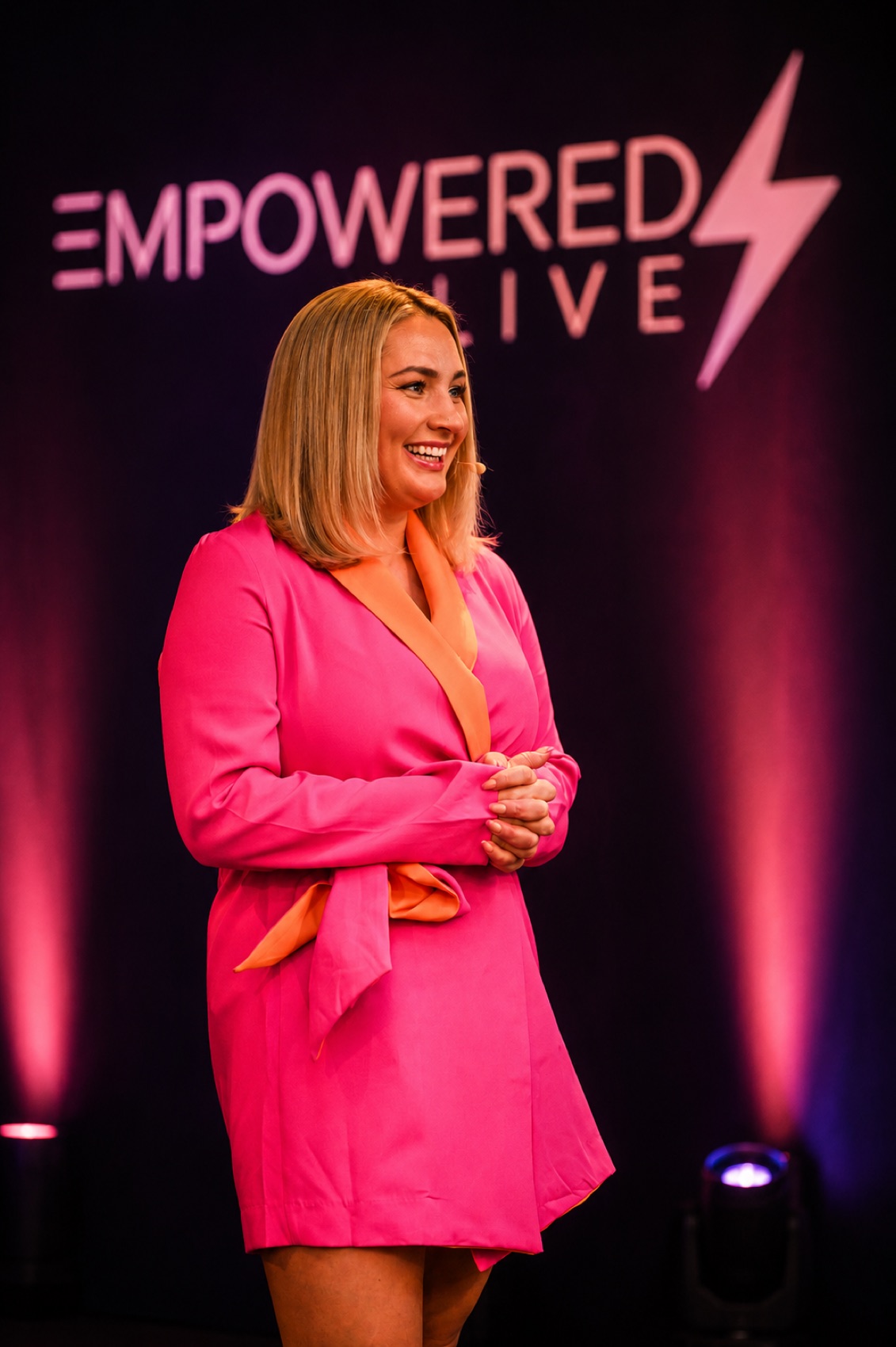 Emily Mallender speaking on stage at EMpowered Live